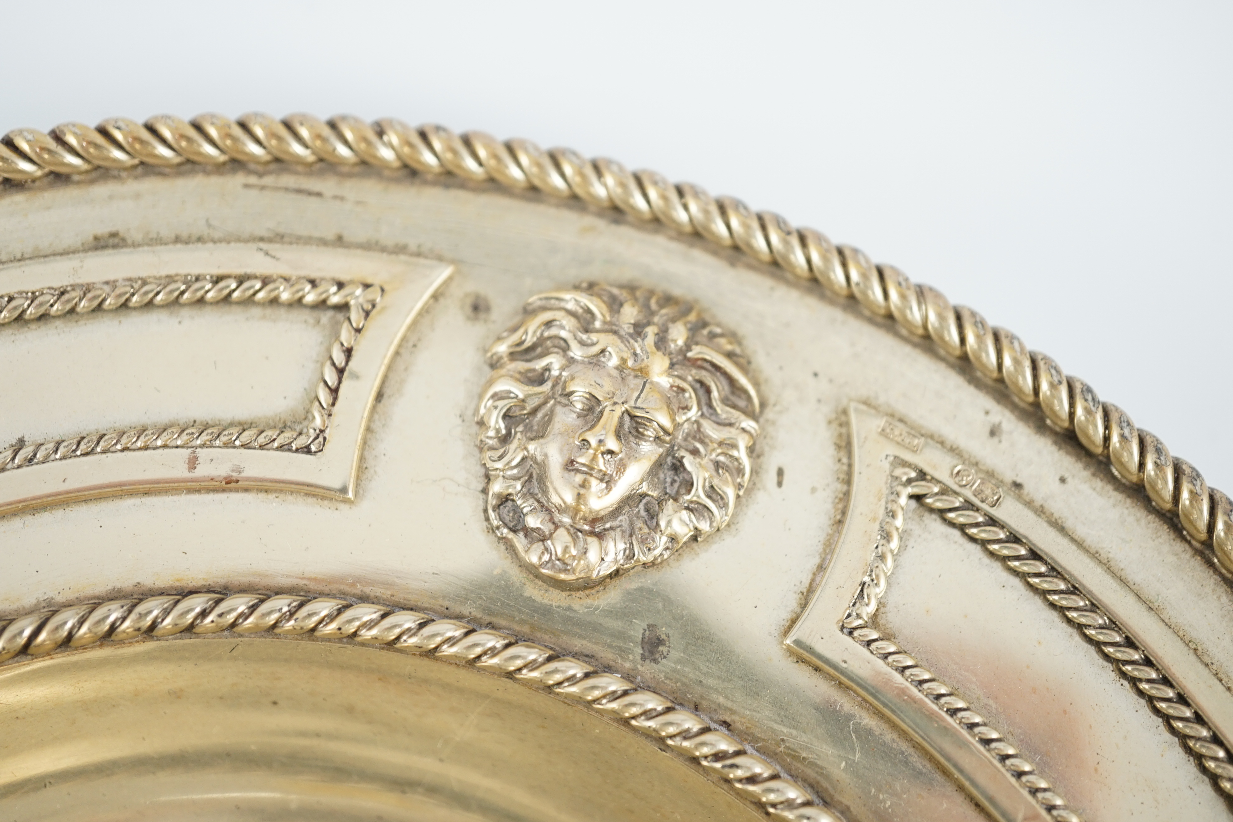A Victorian silver gilt circular inkstand, by Robert Hennell III
